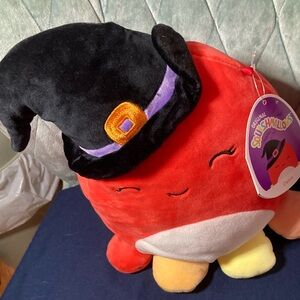 Squishmallows Detra the octopus she is orange with Black Witch Hat